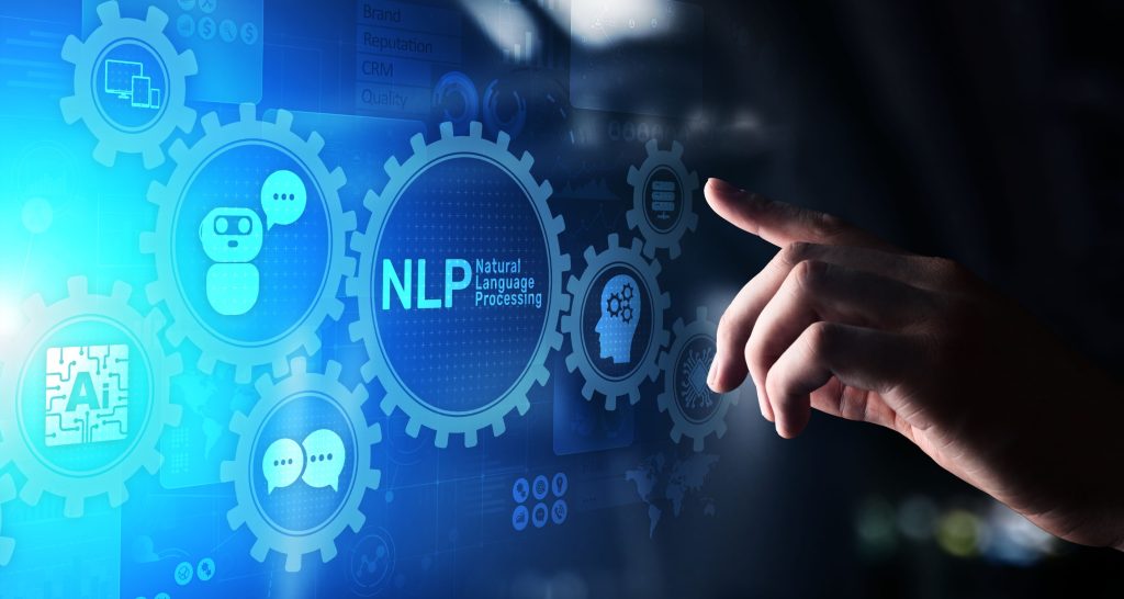 پردازش زبان طبیعی چیست؟ بازدید کامل مفاهیم و کاربردهای NLP_خبرخوان 11 دست یک شخص در حال لمس تصویر اسکریم که ر روی آن نوشته شده nlp